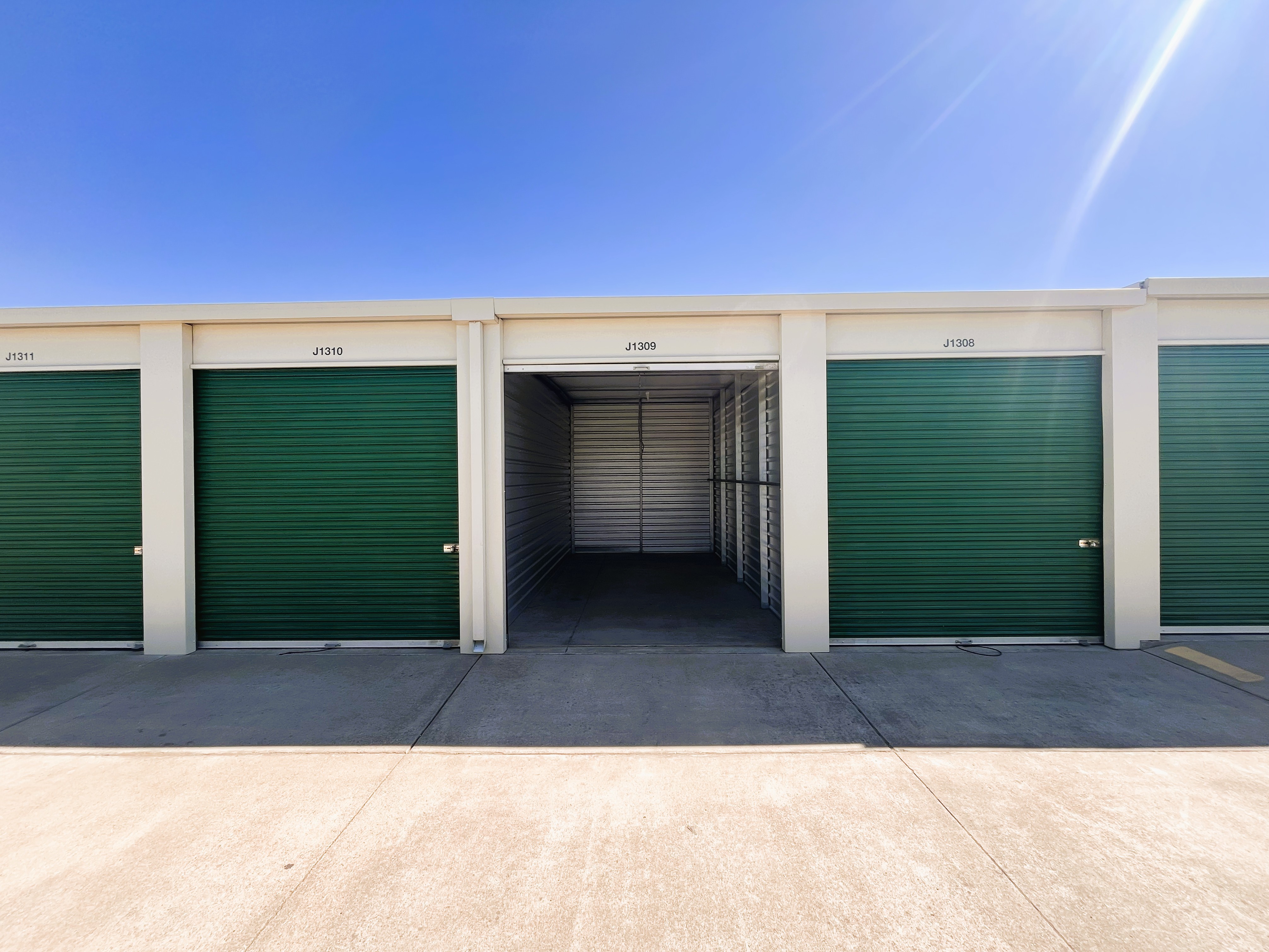 Medium storage units with drive up access and enhanced security